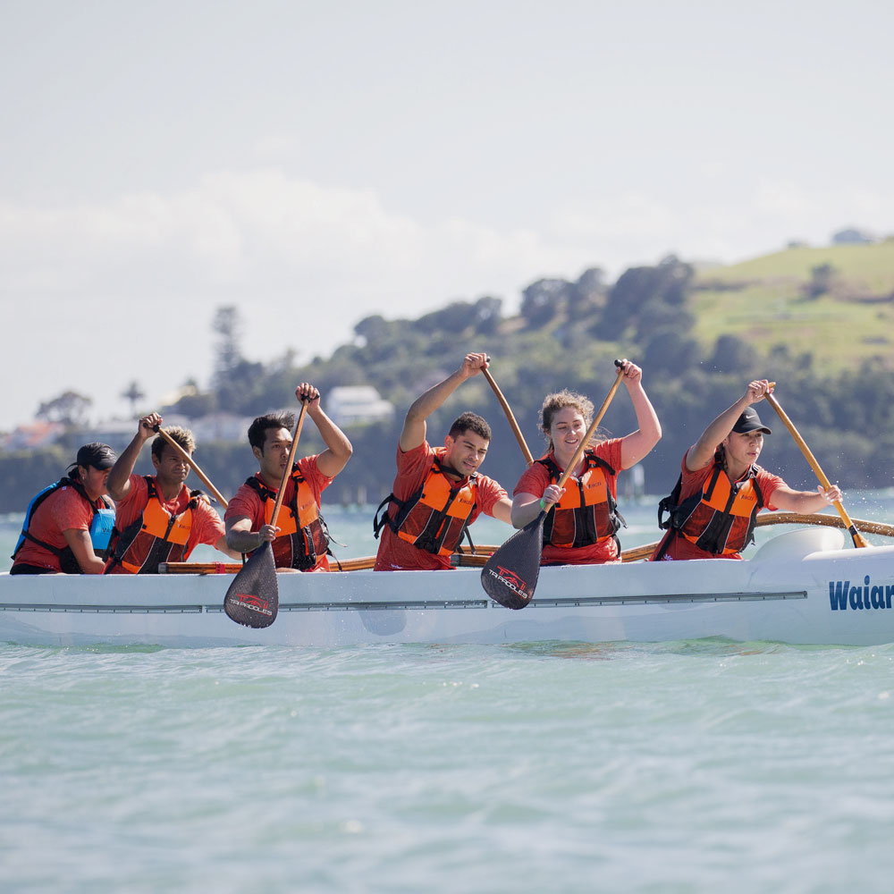 Students paddling in the Waka Ama race