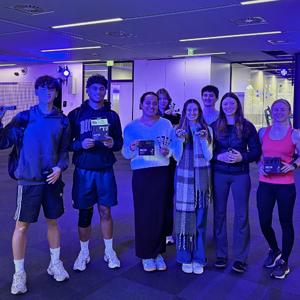 Group of students holding free samples