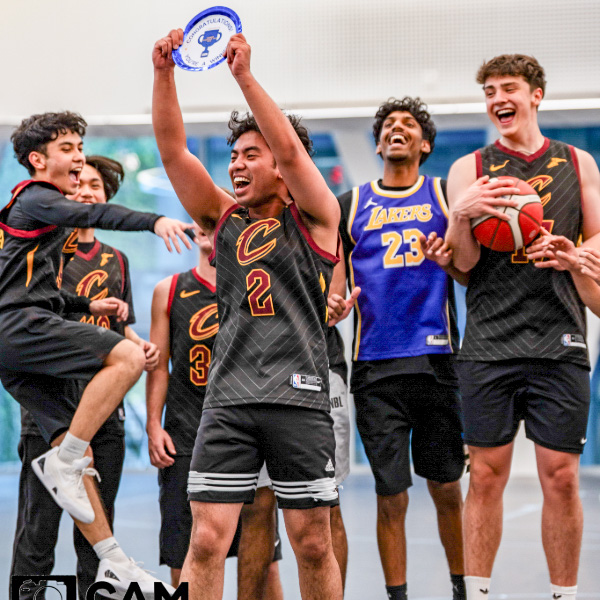 Students celebrating during a UniM8S social sports game